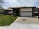 Charming brick and siding home with a well-manicured front yard and attached two-car garage at 4740 W 108Th Pl, Westminster, CO 80031