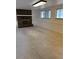 Comfortable living room with a brick fireplace, large windows, and recessed lighting for a cozy ambiance at 4740 W 108Th Pl, Westminster, CO 80031