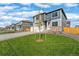 A charming exterior view shows a well manicured lawn, complemented by contemporary home designs at 3234 Belleville Ridge Rd, Elizabeth, CO 80107