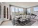 Elegant dining room with modern decor, natural light, and views of the neighborhood, perfect for entertaining at 14128 Bunny Hop Ln, Parker, CO 80134