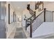 Inviting foyer with hardwood floors, staircase, and modern decor at 14128 Bunny Hop Ln, Parker, CO 80134