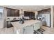 Well-equipped kitchen featuring a central island, stainless steel appliances, and sleek dark cabinetry at 14128 Bunny Hop Ln, Parker, CO 80134