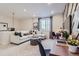 Bright living room features contemporary furniture, a decorative accent wall, and functional workspace at 14128 Bunny Hop Ln, Parker, CO 80134