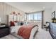 Serene main bedroom with large windows, plush bedding, and stylish accent wall for a relaxing retreat at 14128 Bunny Hop Ln, Parker, CO 80134