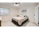 Comfortable bedroom featuring a ceiling fan and a window for natural light at 8335 Fairmount Dr # 7-207, Denver, CO 80247