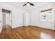 An empty bedroom with natural light, hardwood floors, and closet at 2641 N Clayton St, Denver, CO 80205