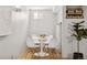 Charming dining area features a round table, white chairs and natural light at 2641 N Clayton St, Denver, CO 80205