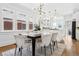 Light-filled dining area with modern lighting and connection to the open kitchen at 2641 N Clayton St, Denver, CO 80205