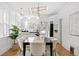 Dining area featuring modern lighting and adjacent to an open kitchen area at 2641 N Clayton St, Denver, CO 80205