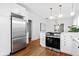Spacious kitchen with stainless steel appliances, modern cabinets, and hardwood floors at 2641 N Clayton St, Denver, CO 80205