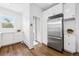 A bright kitchen featuring stainless steel appliances and white cabinets at 2641 N Clayton St, Denver, CO 80205