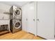 Functional laundry room with stacked washer/dryer and a utility sink for convenience at 2641 N Clayton St, Denver, CO 80205