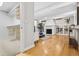 Spacious living room with fireplace, hardwood floors, and adjacent walk-in closet at 2641 N Clayton St, Denver, CO 80205