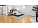 Comfortable main bedroom boasts hardwood floors and great natural light at 2641 N Clayton St, Denver, CO 80205