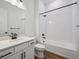 Clean bathroom with white subway tiles and a white vanity with black hardware at 1111 Joseph Pl, Erie, CO 80026