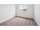 Bright, empty bedroom with neutral carpet, large window and clean, white walls at 1111 Joseph Pl, Erie, CO 80026