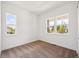 Well-lit room with neutral carpet and multiple windows offering bright outdoor views at 1111 Joseph Pl, Erie, CO 80026