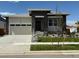 Attractive single-story home boasting a stone facade, a two-car garage, and well-maintained landscaping at 1111 Joseph Pl, Erie, CO 80026