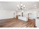 Spacious kitchen with large island, modern lighting, and ample open living space at 1111 Joseph Pl, Erie, CO 80026