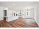 Open concept kitchen with stainless steel hood, large island, and plentiful storage space at 1111 Joseph Pl, Erie, CO 80026