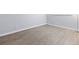 Spacious bedroom with light gray walls and wood-look floors at 7455 E Quincy Ave # 101, Denver, CO 80237