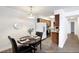 Small dining area adjacent to kitchen with table and chairs at 7455 E Quincy Ave # 101, Denver, CO 80237