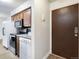 Kitchen with granite countertops, stainless steel appliances, and laundry at 7455 E Quincy Ave # 101, Denver, CO 80237