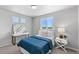 Inviting bedroom with a functional desk area, ample natural light, and serene decor at 22043 E 38Th Pl, Aurora, CO 80019