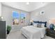 Charming bedroom featuring a lush indoor plant and large windows for ample natural light at 22043 E 38Th Pl, Aurora, CO 80019
