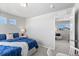 Comfortable bedroom features a large window and a view into another room at 22043 E 38Th Pl, Aurora, CO 80019