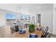Dining area flows from kitchen, with modern wood table setting and natural light at 22043 E 38Th Pl, Aurora, CO 80019