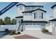Under construction; charming two-story home showcasing a crisp white color palette and a spacious two-car garage at 22043 E 38Th Pl, Aurora, CO 80019