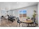 Bright game room featuring a foosball table and table with chairs leading out to the backyard patio at 22043 E 38Th Pl, Aurora, CO 80019