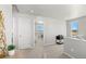 Hallway with view of breakfast nook, wood desk, carpeted floor and stairway at 22043 E 38Th Pl, Aurora, CO 80019
