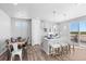 Open-concept: kitchen with stainless steel, and island seating near dining and patio doors at 22043 E 38Th Pl, Aurora, CO 80019
