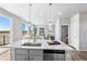 Kitchen island with stainless steel appliances overlooks living area, perfect for entertaining at 22043 E 38Th Pl, Aurora, CO 80019