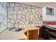 Unique basement wet bar area featuring a striking stone accent wall at 9270 Tennyson St, Westminster, CO 80031