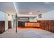 Retro basement with a unique bar area, wood paneling, and stone accents at 9270 Tennyson St, Westminster, CO 80031