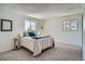 Bright bedroom features plush carpeting, ample natural light from the many windows, and neutral color accents at 9270 Tennyson St, Westminster, CO 80031