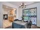 Dining area featuring stylish chandelier, access to the backyard, and an adjacent kitchen at 9270 Tennyson St, Westminster, CO 80031