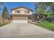 Inviting home with a spacious driveway, attached garage, and a beautifully maintained lawn at 9270 Tennyson St, Westminster, CO 80031