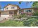 Charming two-story home with brick and siding exterior and a well-manicured front yard at 9270 Tennyson St, Westminster, CO 80031