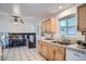 Spacious kitchen with bright cabinets, neutral countertop and open design, ideal for entertaining at 9270 Tennyson St, Westminster, CO 80031
