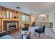 Cozy living room with wood paneled walls, fireplace, and comfortable seating for relaxation at 9270 Tennyson St, Westminster, CO 80031