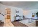 Open living area with tile flooring, carpet, and an open view into the kitchen and dining area at 9270 Tennyson St, Westminster, CO 80031