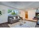 Bright living room with large window, modern furniture, and neutral decor, creating a welcoming space at 9270 Tennyson St, Westminster, CO 80031