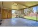 Large covered patio area overlooking a well-maintained backyard and garden at 9270 Tennyson St, Westminster, CO 80031