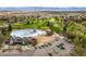 Aerial view of a community pool and golf course with mountains in the background at 9521 Joyce Ln, Highlands Ranch, CO 80126