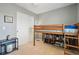 Bedroom lofted bed with under-storage next to a white closet at 9521 Joyce Ln, Highlands Ranch, CO 80126