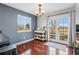 Dining area featuring hardwood floors, modern lighting, and access to the outdoor patio at 9521 Joyce Ln, Highlands Ranch, CO 80126